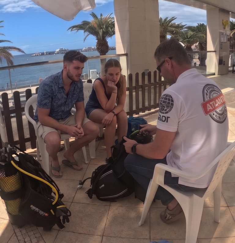 padi course for begiiners day 1, taught in diving atlantis in los cristianos. The instructor is teaching the theoretical part before the first dive in the ocean