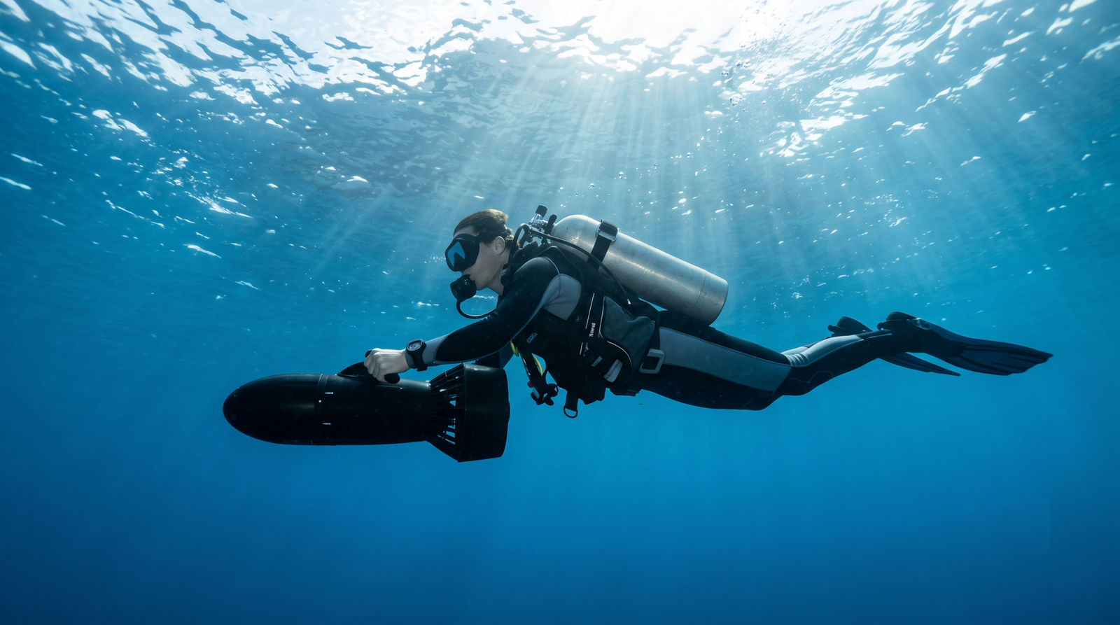 diver diving with dpv tenerife diving atlantis