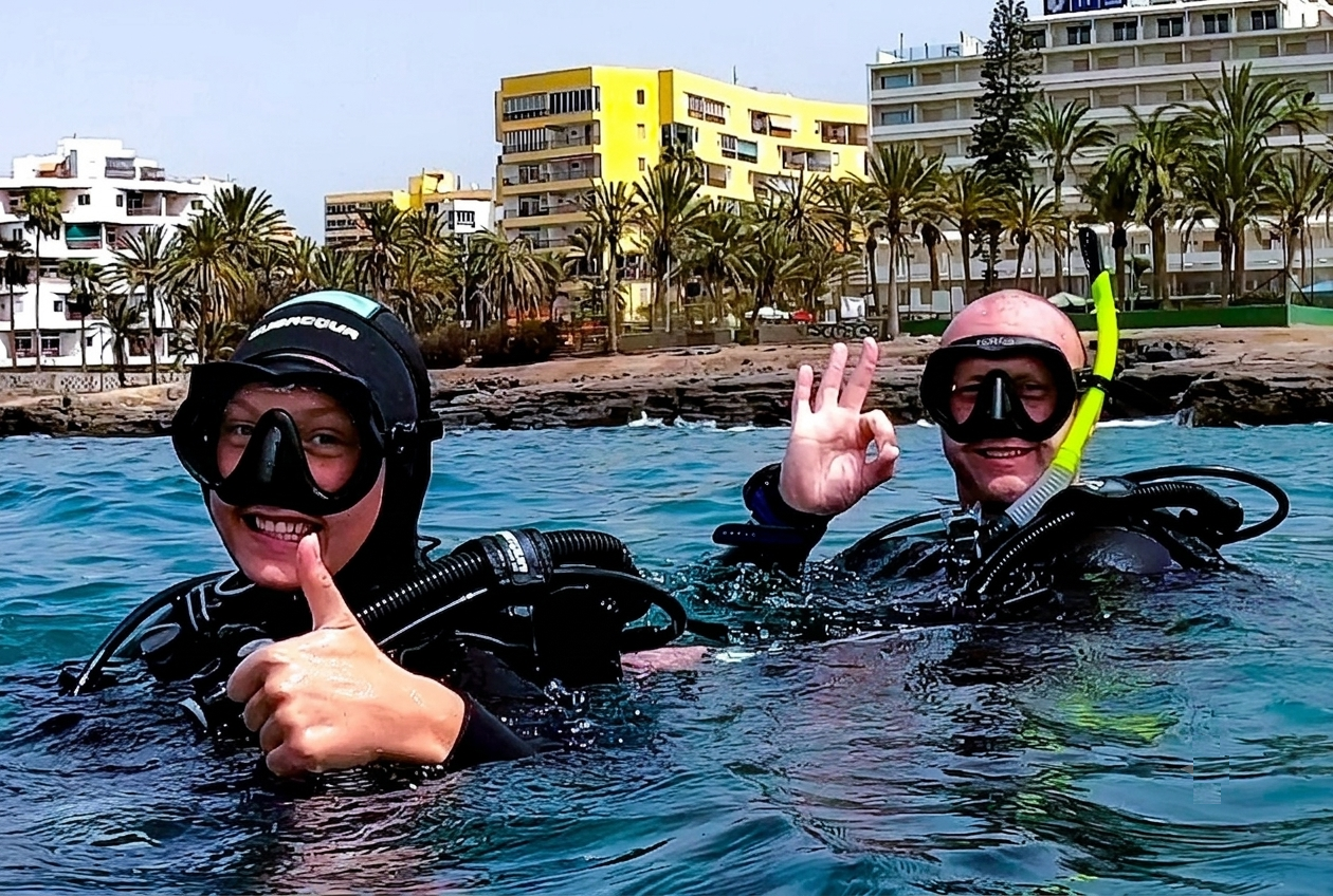 shore diving tenerife los cristianos 2 happy divers finishing a fantastic dive in los tarajales rays bay